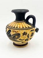 Full view of vase front showing motifs and form