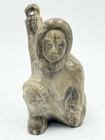 Front view of soapstone Inuit hunter sculpture