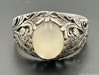 Front view showing cabochon and filigree detail