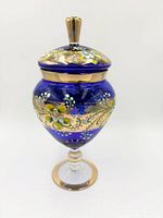 Full view of cobalt blue lidded pedestal jar showing enamel and gold decoration