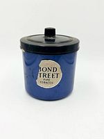 Front view of blue Bond Street Pipe Tobacco tin with lid and label visible