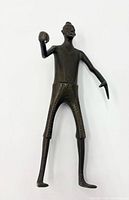 Front view of bronze standing figure