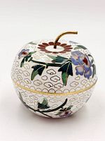 Apple-shaped cloisonné trinket box exterior with floral motif and stem finial