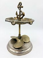 Full view showing anchor finial, scalloped tray, propeller and base