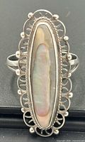 Front view of sterling silver ring with elongated abalone shell cabochon
