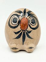 Front view showing owl face decoration