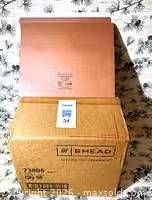 Closed Smead folder resting on the original shipping box