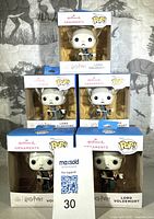 Stacked view of five boxed Lord Voldemort ornaments