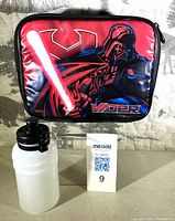 Front view showing Darth Vader graphic on lunch bag and water bottle