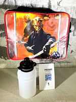 Front of lunch bag showing Darth Maul image with water bottle in foreground