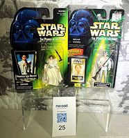 Front view of both factory-sealed action figures in packaging