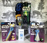 Front view of sealed Darth Vader figure and two keychains