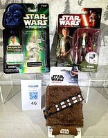 Front view of Luke Skywalker figure, Han Solo figure, and Chewbacca can cooler