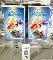Front view of both VHS tapes showing cover art
