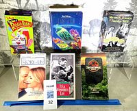 Front view of six VHS tapes standing upright showing cover art and titles