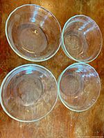 Top view of four clear glass bowls showing sizes