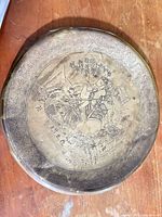 Full view of brass tray showing entire engraved hunting scene and border