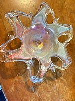 Top view showing six-lobe star shape and iridescent finish