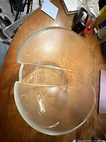Top view of one round divided platter showing frosted texture and clear divider