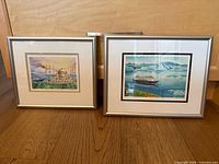 both framed prints side by side
