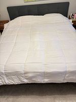 White king duvet spread on bed showing overall condition
