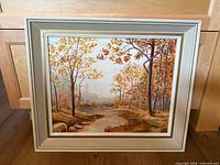 Front view of framed painting showing full artwork and frame