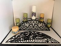 Stand with scrollwork arch and six candles displayed