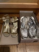 Gold and silver Rangoni heels in boxes