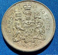 Reverse side of 1966 Canadian silver half dollar showing coat of arms and date