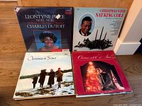 Group of four LPs: Leontyne Price Noël, Christmas With Nat King Cole, Christmas in France, Christmas With the Stars (red cover)