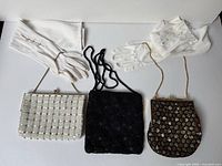 Group shot showing all three purses and two pairs of gloves
