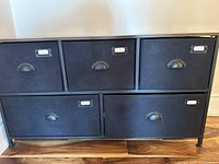 Front view showing five drawers, metal frame, pulls and label holders