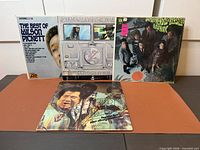 All five album jackets displayed upright with one laid flat