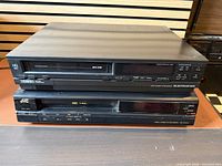 Front view of Electrohome HVR D51 stacked on JVC HR-D310U