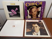 Four album jackets displayed: Level 42, Culture Club, Pet Shop Boys, Robert Palmer