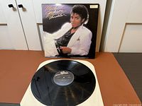 Album cover front and vinyl record on sleeve