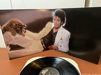Gatefold interior with Michael Jackson and tiger cub plus black vinyl on inner sleeve