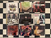 Front covers of nine CD cases arranged in 3×3 grid
