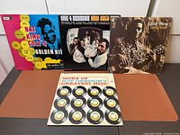 Four LP jackets standing with Roy Orbison jacket flat