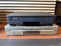 Front view of stacked Panasonic VCR and Sanyo DVD player