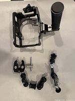 Overall view showing cage, top handle, clamp, magic arms