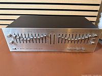 Front view showing all 10 frequency sliders per channel and LED meters