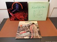 Three gatefold album jackets: Beach Boys In Concert, Stevie Wonder Journey Through The Secret Life of Plants, Woodstock soundtrack