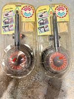 Front view of both packaged Auto Pal rotating scrub brushes