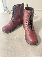 Front view of both burgundy combat boots