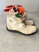 Side profile of both shoes showing color scheme, laces, stitching and soles