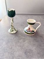 tulip-form candlestick and handled chamberstick side by side