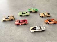 Top view of all seven cars showing colours and styles