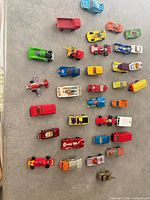All 30 vehicles arranged in grid on tabletop, view from above