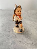 Front view of porcelain School Boy figurine
